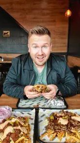 A creator visits M's Smokehouse in Reading to review their halal BBQ offerings, including a signature burger, loaded fries, and Nashville fried mozzarella.
