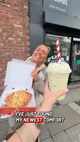 A fast-paced, engaging review of a takeaway spot, featuring a look at the kitchen preparation and a taste test of their calzone, wings, fries, and milkshake.