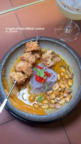 A high-quality, visually appealing reel showcasing a variety of Neo-Nikkei and Cantonese fusion dishes at a restaurant in Notting Hill. The video features close-up shots of food preparation, plating, and the final dishes, interspersed with a brief shot of the creator enjoying the meal.
