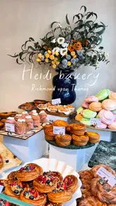 A short, aesthetic reel showcasing the food selection at Heidi Bakery in Richmond. The video features close-ups of various pastries, including cruffins and croissants, as well as sandwiches and cakes, highlighting the textures and fillings.