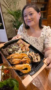 A food vlog featuring a visit to 'The On', a Korean restaurant in Wimbledon. The creator samples various dishes including side dishes, grilled short rib patties (tteokgalbi), pork belly, jumbo prawns, kimchi jjigae, and Naju Gomtang. The video includes shots of the chef preparing the food and explains the dining experience.