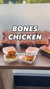 A promotional reel showcasing various chicken wings, burgers, and fries from Bones Chicken in Potters Bar, highlighting their award-winning status and menu variety.