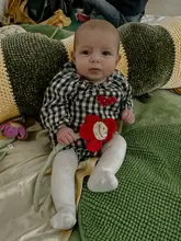 A candid, personal photograph of a baby sitting on a soft play mat, likely at a baby sensory class. The image captures a moment of the child's day rather than serving as a professional marketing asset for the venue.