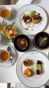 A visually appealing tour of a prestigious tea house in Covent Garden, showcasing the elegant interior, the tea service, and the brunch menu. The video uses calm, aesthetic shots to highlight the sophisticated atmosphere and the quality of the food and tea.