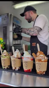 A promotional video for a new ice cream stall called Swirl, located at Aberdeen Beach. The video showcases the menu board and the preparation of various soft-serve sundaes, including flavours like Matcha, Dubai Chocolate, Kinder Bueno, Strawberry Shortcake, and Lotus Biscoff, finishing with shots of the finished products by the sea.