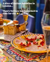 A promotional shot of an Italian terrace setup featuring bruschetta, focaccia, and wine, designed to evoke a summer dining experience.