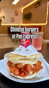 A short, upbeat video showcasing the revamped Pan Express venue, highlighting the interior seating area, the new coffee bar, and their signature crispy honey chicken Chinese burger.