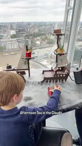 A mother and son enjoy a Peter Pan-themed afternoon tea at Aqua Shard, featuring creative food presentation and skyline views.
