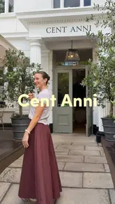 The video is a review of a new Italian restaurant called Cent Anni in St John's Wood. The creator introduces the venue, highlights the atmosphere, and showcases the food and drinks, including a steak dish and desserts.