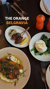 A montage video showcasing The Orange Belgravia, featuring exterior shots, interior ambiance, and a variety of dishes including cocktails, burrata, meatballs, fish, pizza, truffle potatoes, and dessert.