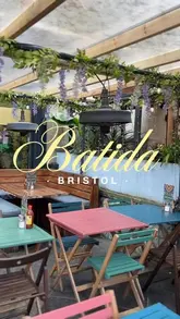 A short, energetic montage showcasing the interior, patio, cocktails, and food offerings at Batida in Bristol, specifically highlighting their bottomless brunch experience.