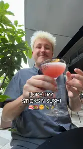 A review of a meal at Sticks'n'Sushi, featuring cocktails, sushi, and skewers in an outdoor setting.
