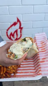 A short, fast-paced montage showcasing a large food platter, a Caesar wrap, waffle fries, and dessert cups from Ragin' Bird.