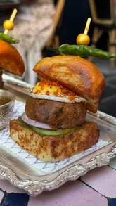 The video presents a curated list of ten London restaurants, featuring a mix of cuisines and dining styles. The creator provides brief, enthusiastic commentary on each venue while showcasing close-up shots of signature dishes and some interior glimpses. The editing is fast-paced and engaging, designed to encourage viewers to save the video for future dining inspiration.