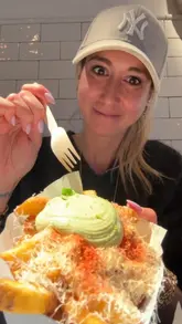 A review of Frites Atelier in Soho, London, showcasing their luxury loaded fries, including the preparation process, various toppings, and the creator's reaction.