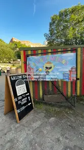 A promotional video for a comedy festival at Fairfield Social Club in Manchester. The video features quick cuts of the venue's exterior, entrance, and interior performance space, overlaid with text detailing the event and ticket pricing.