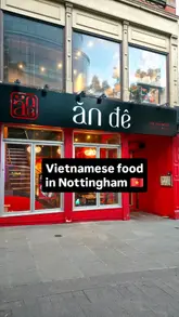 A short, energetic video showcasing a visit to a Vietnamese restaurant, featuring close-ups of fresh summer rolls, noodle dishes, pho, and cocktails, set to music with a relatable text overlay.