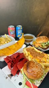 A review of The Crispy Catch in Cardiff, featuring their new chicken burger smash box, fish and chips, and red kebab meat. The creator highlights the portion sizes, quality of the batter, and the 30% off Uber Eats promotion.