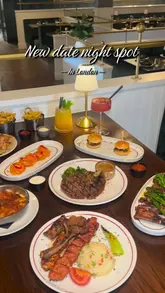 A promotional reel for 'The Banc' restaurant, showcasing the interior, bar service, and a variety of dishes including steaks, mixed grills, and cocktails.