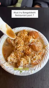 A vlog-style review of a Bangladeshi street food venue in East London, featuring various authentic dishes like fuchka, beef seekh kebabs, lassi, and tehari.