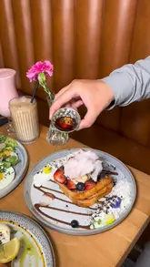 A short, aesthetic montage showcasing a brunch visit to The Fulham House. The video features close-ups of various brunch dishes like French toast, avocado toast, and eggs, alongside shots of the cozy interior and the venue's exterior.