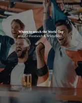 A promotional image featuring a group of men cheering while watching a match, used to advertise venues in Prestwich and Whitefield for the World Cup. The image uses a stock-style photo to evoke the atmosphere of a sports bar.
