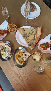 A fast-paced venue tour of Freight Island in Newcastle, highlighting the large interior space, various food stalls, bar areas, live entertainment, and rooftop views.