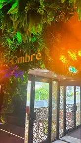 A fast-paced montage video showcasing the interior and various dishes at Ombre Restaurant & Lounge, set to music with text overlays.