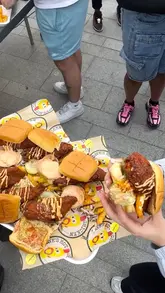 A creator visits the new Dave's Hot Chicken pop-up in Dublin, showcasing the food preparation process and sharing their reaction to the spicy chicken.