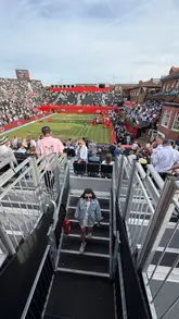 A montage video showcasing the atmosphere at the Queens Club during the grass court tennis season, featuring clips of tennis matches and a Pimm's station.