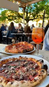 A short, energetic reel showcasing outdoor dining at Bath Pizza Co, featuring pizzas, dips, and various spritz cocktails.