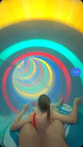 A montage of clips showcasing a family day out at Coral Reef Waterworld, featuring water slides, a pirate ship play area, and swimming pools.