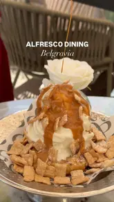 A promotional reel for the EL&N Belgravia branch, highlighting their outdoor dining area and a selection of menu items including burrata, Caesar salad, sandwiches, and a cinnamon cookie soft serve dessert.