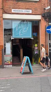 A montage of food and interior shots at a Cosy Club venue, showcasing various dishes and the restaurant's vintage-inspired decor.