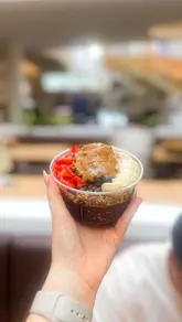 A couple visits Vyve at Meadowhall to try their acai bowls and iced drinks. The video features the preparation process of the food and drinks, followed by the creators tasting the items.