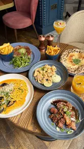 A montage-style video showcasing the interior, exterior, and food offerings at Coppa Club Tower Bridge, emphasizing the riverside location and iconic London views.