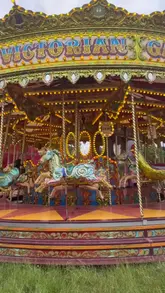 A vibrant, fast-paced reel showcasing The Hoppings fairground in Newcastle, featuring a variety of rides, games, and street food options like steak and chips, donuts, and lemonade.