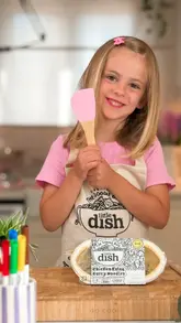 A sponsored video featuring a mother and her two children preparing and eating a 'Little Dish' branded chicken katsu curry meal, highlighting the product's ease of use and the included colouring competition.