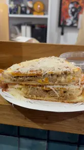 A food review of 'Grandad Needs His Medicine' in Sketty, featuring their Beef Birria Toastie and Turkey Club sandwich, along with a coffee demonstration.
