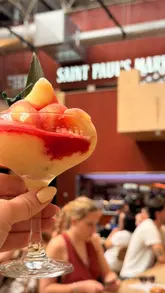A fast-paced montage showcasing various food and drink vendors at Saint Paul's Market, highlighting the diverse range of cuisines and the lively atmosphere.
