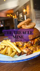 A promotional video for The Treacle Mine, a pub in Grays, showcasing their food and drink offerings, including cocktails, burgers, steaks, and tacos.