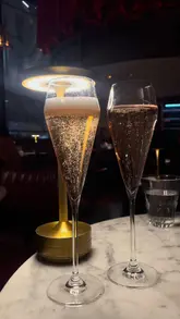 A moody, cinematic montage showcasing the interior and food offerings of a restaurant, specifically highlighting their Sunday roast and chicken dishes.