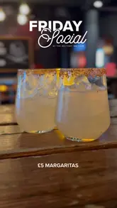 A fast-paced promotional reel for 'The Rectory' featuring a DJ, various margarita cocktails, pub-style food like burgers and wings, interactive darts, and a photo booth, highlighting the venue's Friday social atmosphere.
