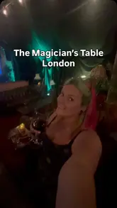 A review of The Magician's Table at The Vaults in London, showcasing the pre-show bar, the immersive atmosphere, and the magic performance.