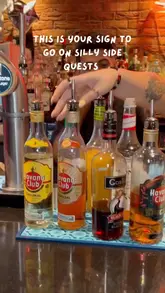 A group of friends visits a cocktail bar, Liquor Store MCR, where they participate in a cocktail-making session with the staff, culminating in the creation of a flaming Zombie cocktail.