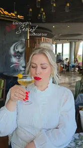 A promotional reel for a cocktail bar in Edinburgh, featuring a montage of cocktails, small plates, and the venue's interior and city views. The video features a couple enjoying the space, highlighting it as a destination for drinks and dining.