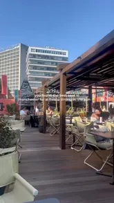 A montage showcasing the outdoor dining area and a variety of Japanese dishes at Sticks'n'Sushi in Manchester.