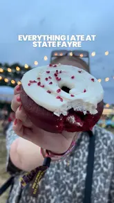 A creator visits a food festival, showcasing three different food vendors: Shwings, Game and Flames, and Rodeo Doughnuts. The video features shots of the menu boards, the food being eaten, and the festival atmosphere.