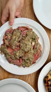A short, punchy review of a Manchester wine and small plates restaurant, featuring close-up shots of various dishes including flatbread, lamb, pork chop, and dessert.