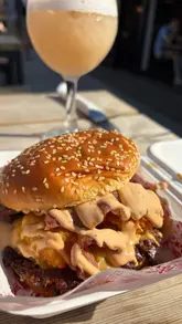 A montage-style video showcasing a street food venue in Cardiff Bay, featuring various food traders including burger, pizza, pasta, and ice cream vendors, alongside cocktails and outdoor seating.